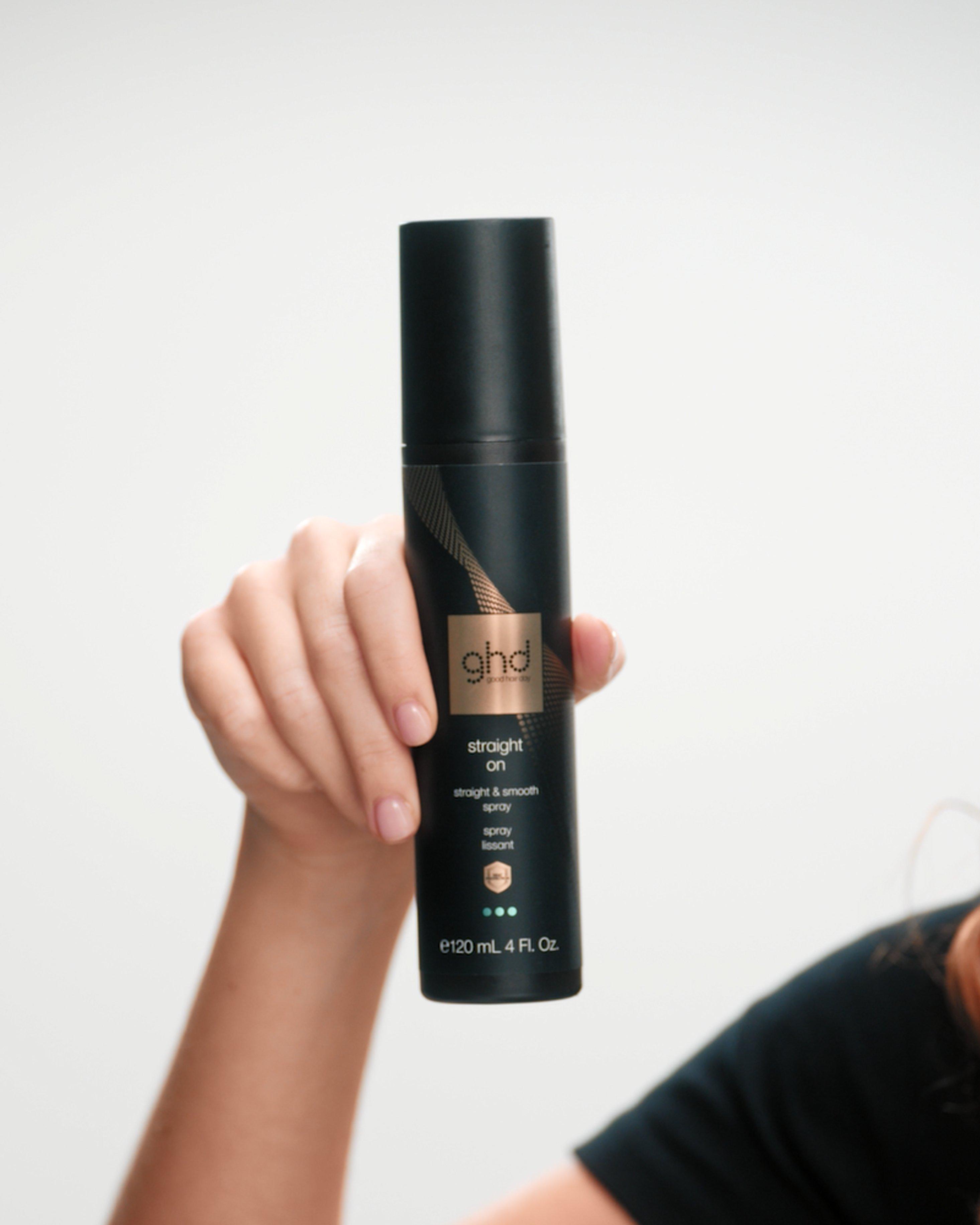 close up of model holding ghd straight on 